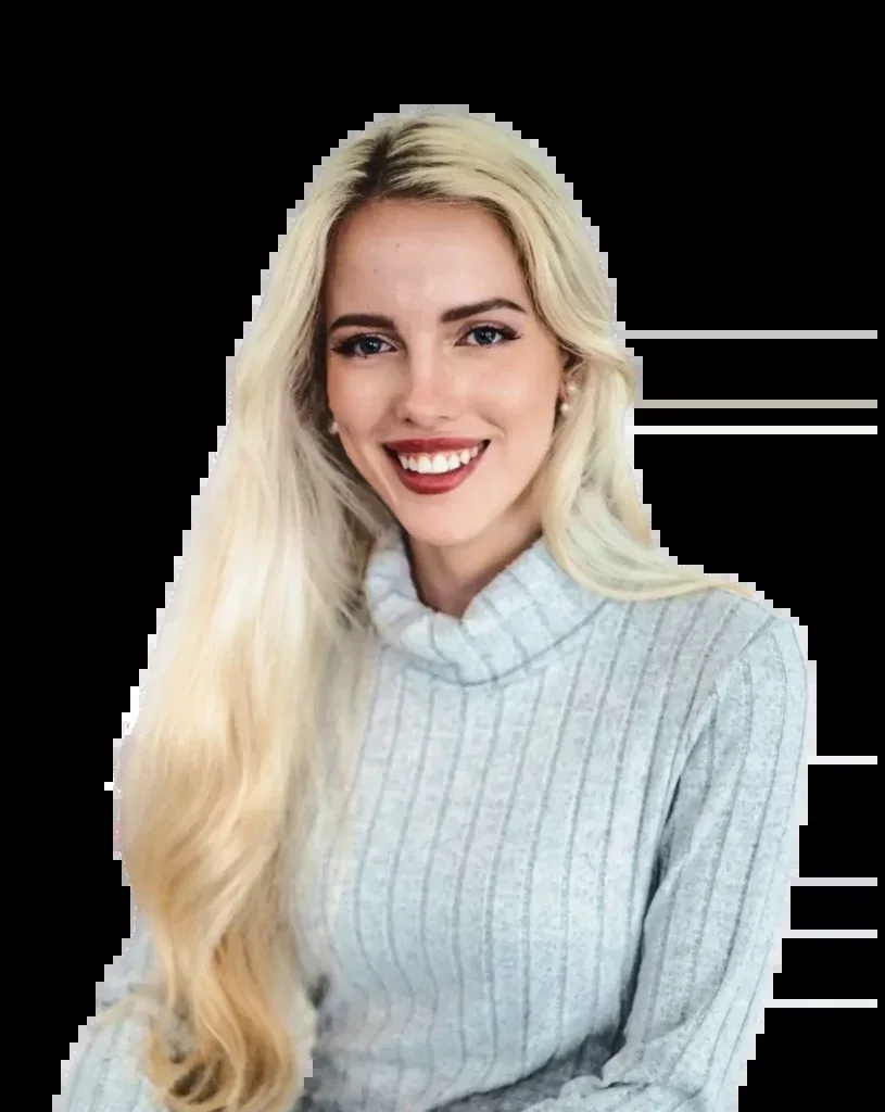 Tjaša Peterle, founder and creative director of Studio Merlin, smiling in a grey knit sweater